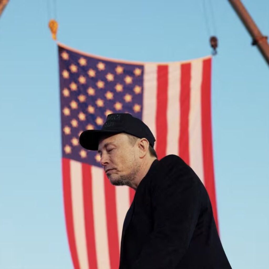 elon musk in front of american flag