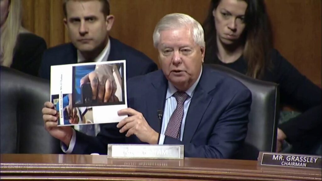 lindsey graham holding ms-13 photos