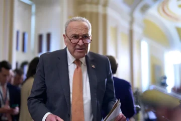 chuck schumer with glasses on