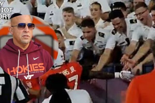 virginia tech college football coach high fiving cadets
