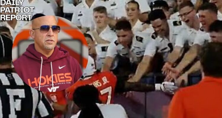 virginia tech college football coach high fiving cadets